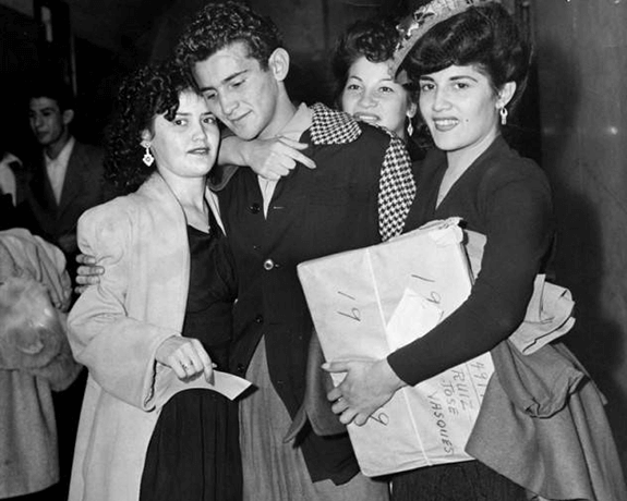 Defendant Robert Telles and family at the Sleepy Lagoon murder case acquittal, 1944, Herald Examiner Collection, Los Angeles Public Library