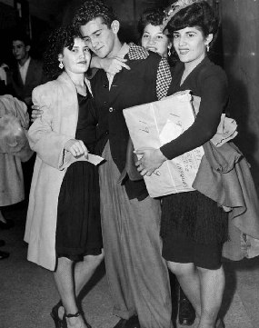 Defendant Robert Telles and family at the Sleepy Lagoon murder case acquittal, 1944, Herald Examiner Collection, Los Angeles Public Library