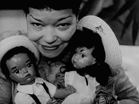 Jackie Ormes with Patty-Jo dolls, film still, One Tenth of a Nation, 1953, Library of Congress